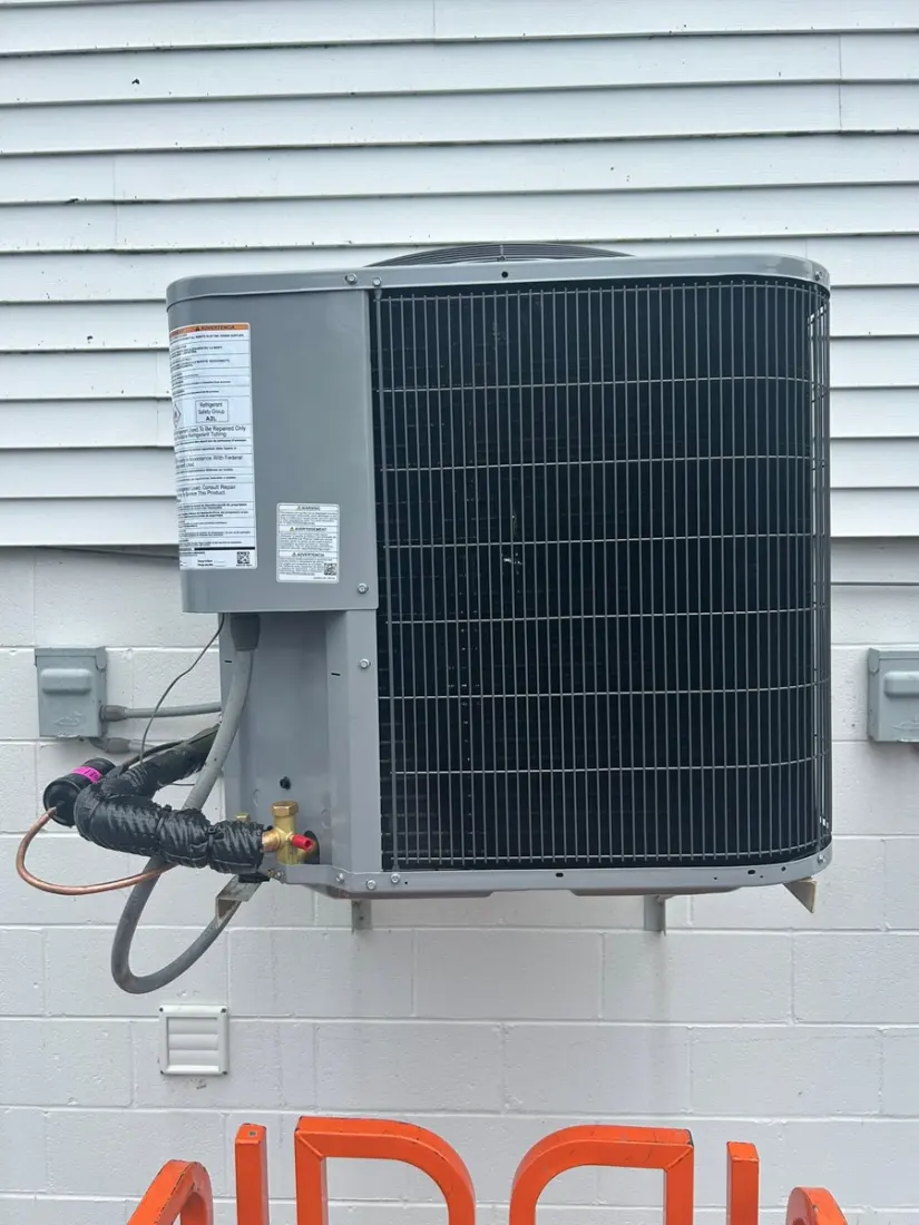 New AC condenser set on a pad at a New Paris, OH residence